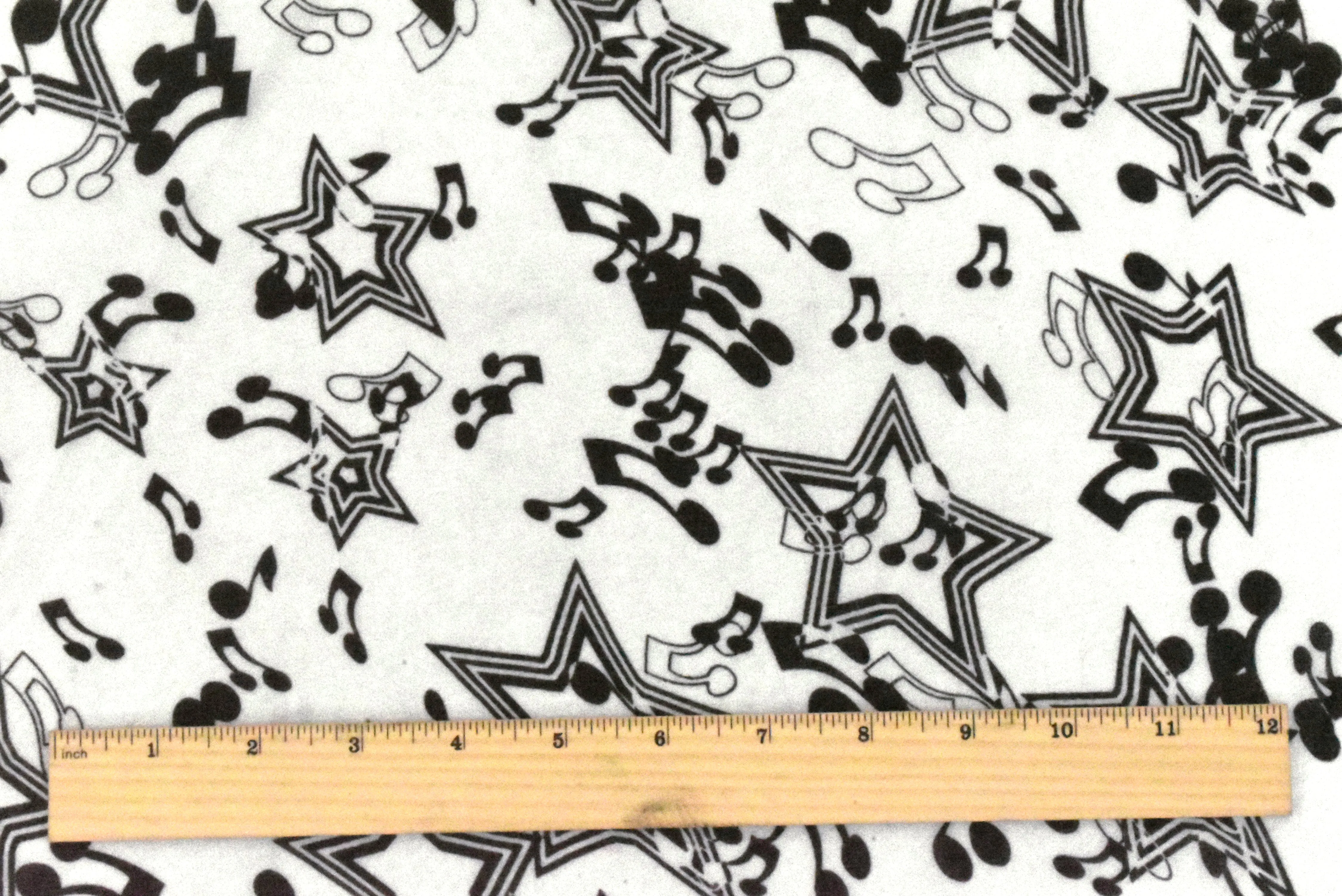 Snow White-Black Star Music Printed Poly Chiffon Woven Fabric